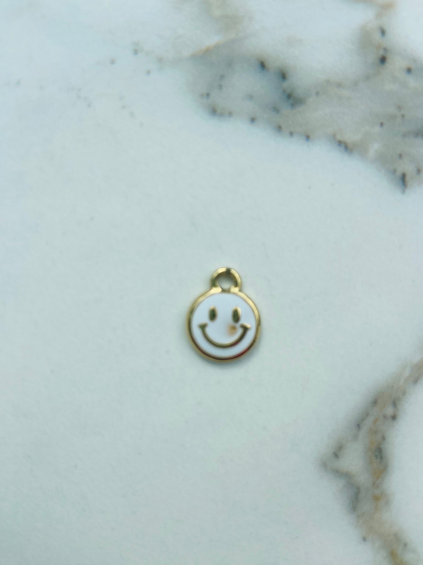 Bedel smiley wit/goud